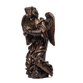 A carved oak figure of a kneeling and praying angel with traces of polychromy, 17th C.