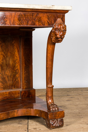 A large French mahogany console with lions' heads and marble top, 19th C.