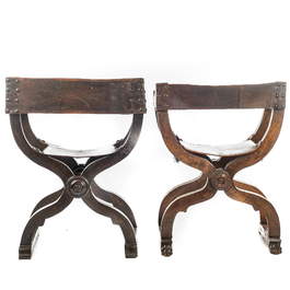 Two leather-mounted wooden 'dagobert' chairs, 19th C.