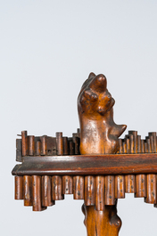 A naturalistic wooden corner rack with three shelves, 19/20th C.