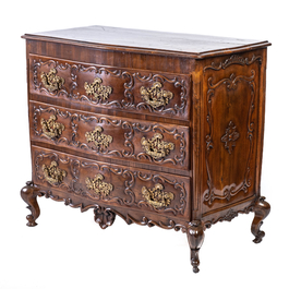 A French Louis XV-style walnut chest of drawers, 19th C.