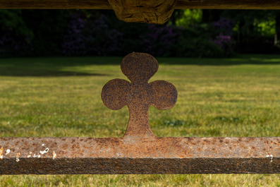 An impressive long wooden table with recesses from the dining room of an orphanage or monastery, 19th C.