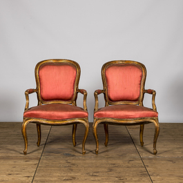 Two French Louis XV-style gilt wooden upholstered armchairs, 19th C.