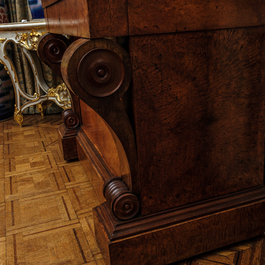 A French Empire-style rootwood veneered wooden console with a grey marble top, 19th C.