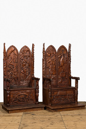 A pair of imposing wooden throne seats with relief design, 20th C.