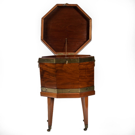 An octagonal mahogany box on four mobile feet, 19th C.
