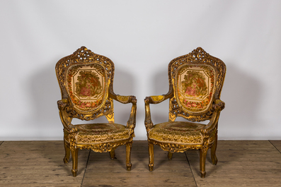 A Louis XV-style gilt wooden salon set comprising a three-seater sofa and two armchairs, 20th C.