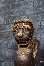 Two pairs of sculpted wooden table legs in the shape of lions, 19th C.