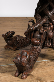 An Anglo-Indian colonial table on a well-carved stand with lions and peacocks, 19th C.