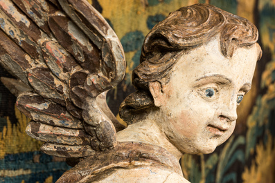 A pair of large polychrome wooden winged cherubs, 19th C.