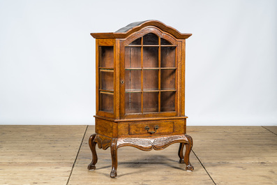 A small oak wooden display cabinet, 20th C.