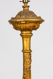 A large gilt carved wooden candlestick mounted as a lamp, 19th C.