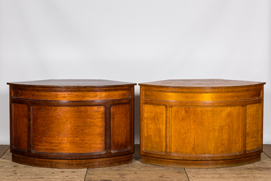 Two oak wooden counters with curved front, 1st half 20th C.