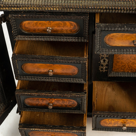 An ebonised and inlaid wooden cabinet, 19th C.