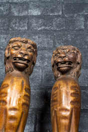 Two pairs of sculpted wooden table legs in the shape of lions, 19th C.