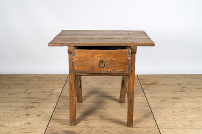 A rustic rural wooden table with drawer, 19th C.