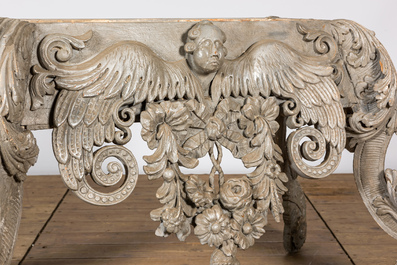 A richly carved grey-patinated wooden jardini&egrave;re, 19th C.