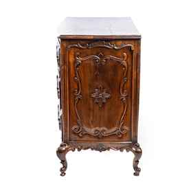 A French Louis XV-style walnut chest of drawers, 19th C.