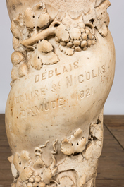 A twisted white marble column with floral design and inscription 'D&eacute;blais Eglise St Nicolas Dixmude 1921', 18th C. and later