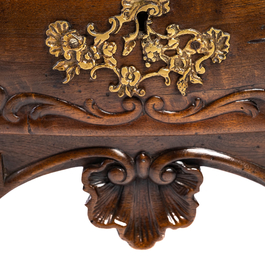 A French Louis XV-style walnut chest of drawers, 19th C.