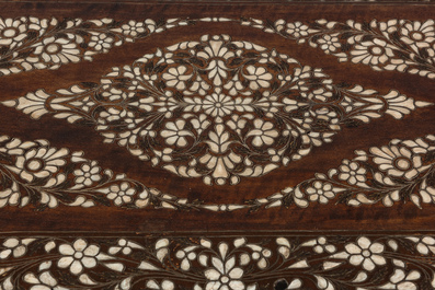 Two Indian dagobert chairs and a coffee table with mother-of-pearl inlay, 20th C.