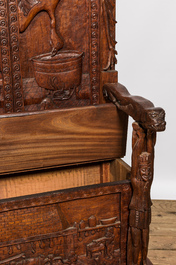 A pair of imposing wooden throne seats with relief design, 20th C.