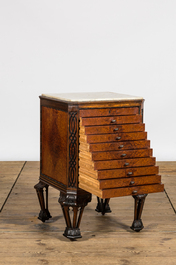 A burl wood veneered coin cabinet with marble top, 20th C.