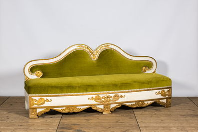 A neoclassical style gilt and patinated wooden sofa, 19th C.