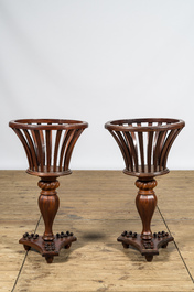 A pair of English Regency-style mahogany plant stands, 19th C.