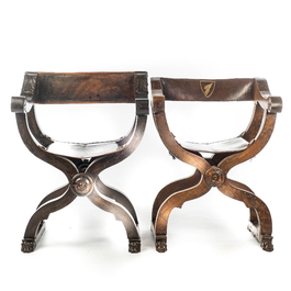 Two leather-mounted wooden 'dagobert' chairs, 19th C.