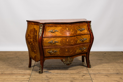 A French Louis XV-style rosewood marquetry chest of drawers, 20th C.