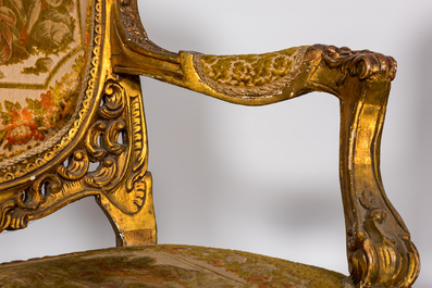 A Louis XV-style gilt wooden salon set comprising a three-seater sofa and two armchairs, 20th C.