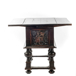 A rare ebonised wooden baluster leg table with polychromed reliefs, 17th C. with later elements