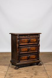 An Italian richly decorated walnut and burl wood chest of drawers with mascarons, 19th C.