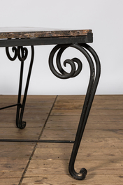 A wrought iron coffee table with marble top, 20th C.