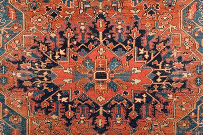 A Persian Heriz rug with floral design and geometric motifs, wool on cotton, 1st half 20th C.