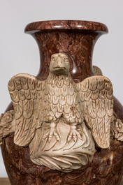 A pair of imposing marble 'eagles' vases, 20th C.