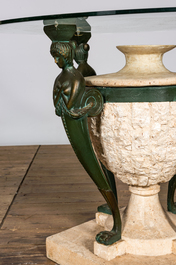 A bronze patinated metal and composite garden table with glass top, 20th C.