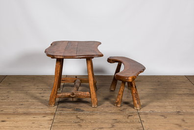 A rural hardwooden garden table with matching bench, 20th C.