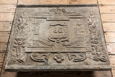 A lead fireplace plaque with the monogram DP and dated 1701