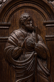 A carved oak panel with saints mounted as a heating frame, 19/20th C.