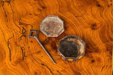 An octagonal engraved and partly gilt reliquary box, 17th C.