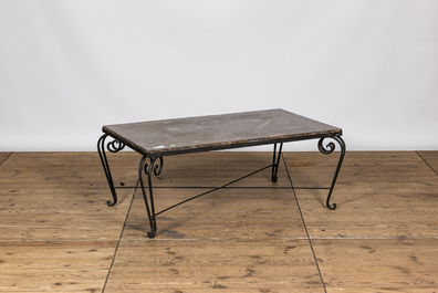 A wrought iron coffee table with marble top, 20th C.