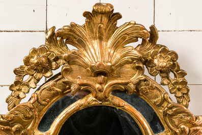 A French carved and gilt wooden Louis XV-style rocaille mirror, 19th C.