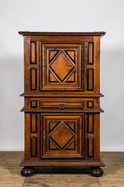 A walnut two-door cabinet with ebonised accents, 17th C.