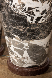A pair of large black and white 'Grand Antique' marble vases and covers on red marble stands, Italy, 20th C.