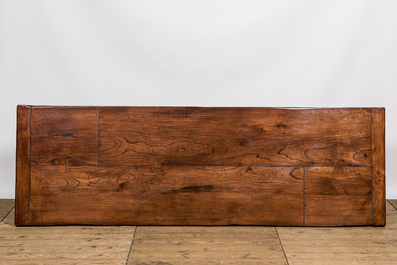 A lacquered wooden table on metal legs, 20th C.