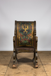 A Russian polychrome wooden ceremonial armchair with an eagle, 19th C.