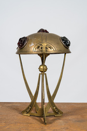 An Art Nouveau brass lamp with coloured cabochons, 20th C.