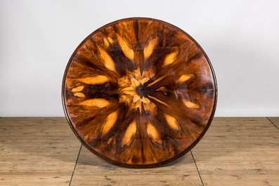 A round rosewood table on a mahogany base, 19/20th C.